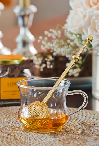 tea infuser in glass cup with handle
