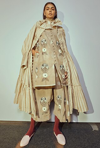 Hand-embroidered and clamp dyed tunic with a stand-collar. Paired with matching drop crotch pants and monochrome printed jacket style dress.