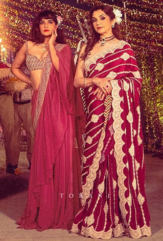 Pre-stitched chiffon lehenga-sari with an embroidered Sindhi Border and a mirror work choli.