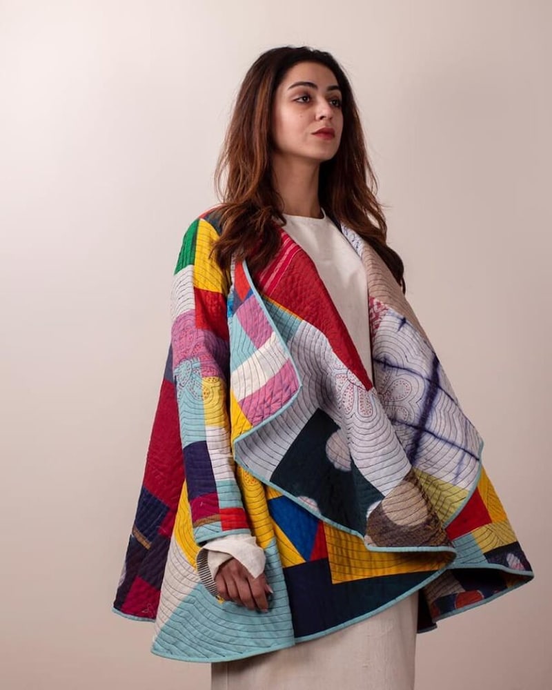 Hand patchwork jacket crafted using upcycled fabrics.