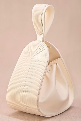 An ivory tote bag in PU and faux leather base with corded loop detailing.