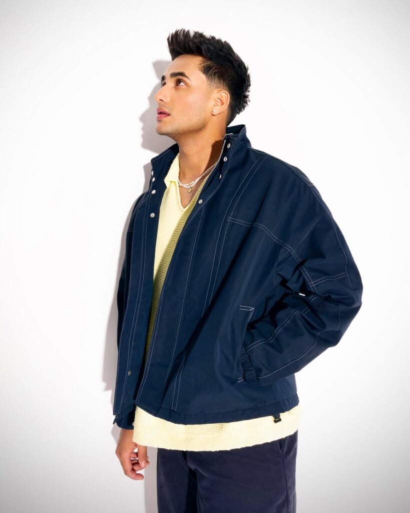 Abhishek Sharma in deep blue jacket 