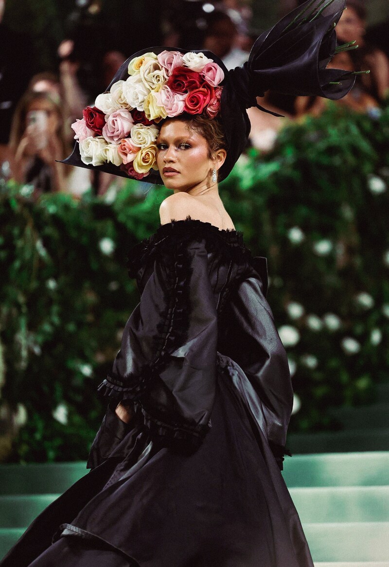 Zendaya in Maison Margiela by John Galliano, a liquid emerald-and-sapphire nature gown with biomechanical petals