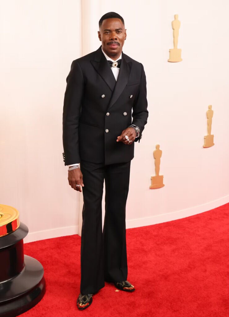  Sporting bell-bottom Louis Vuitton trousers at the 2024 Oscars. 