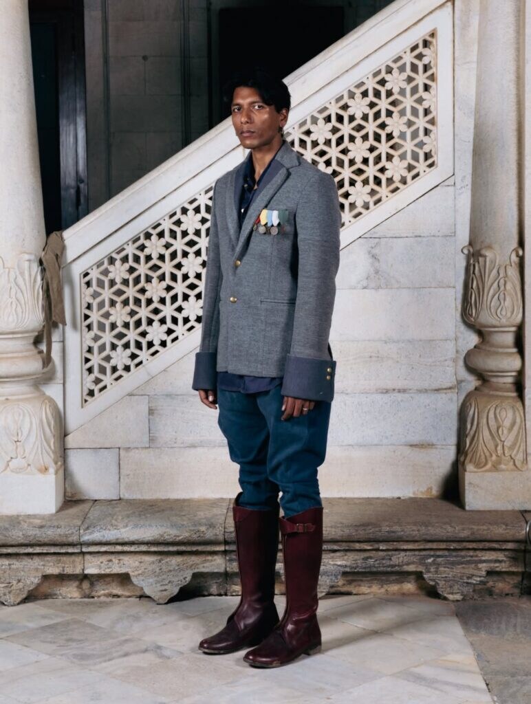 Model presenting the bold first ensemble that set the visual tone for the collection