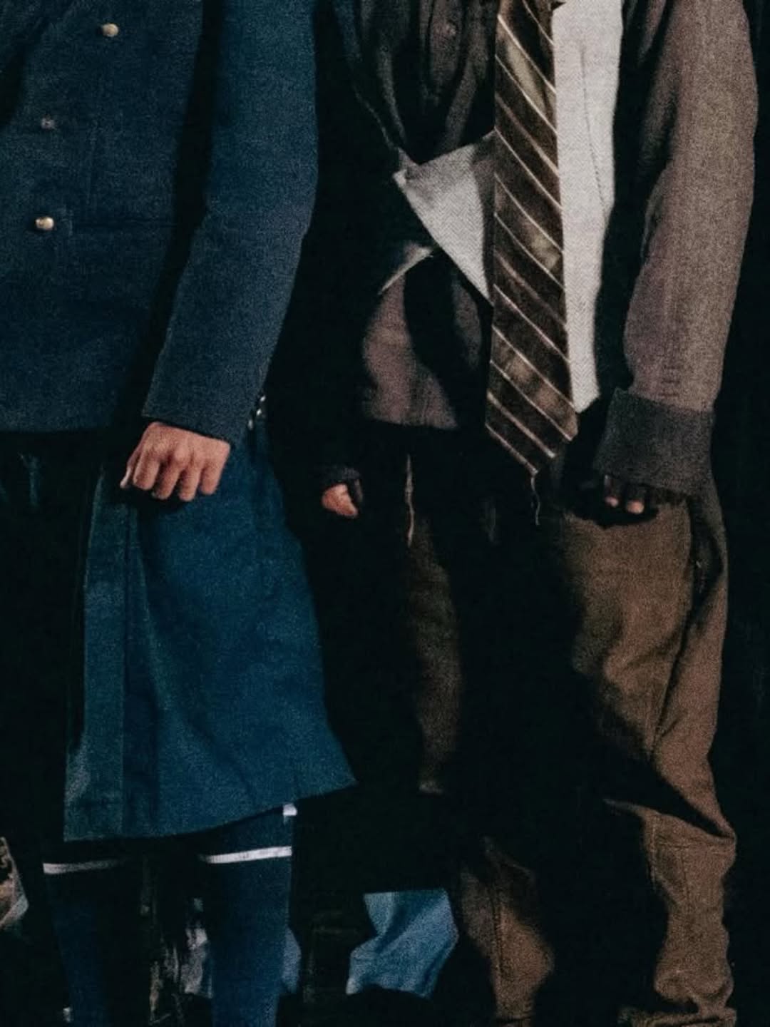 Garments made from repurposed fabrics including upcycled blazers, slouchy pants, and camo separates